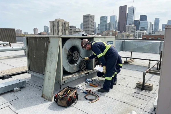 Servicing a make-up air unit blower and belts