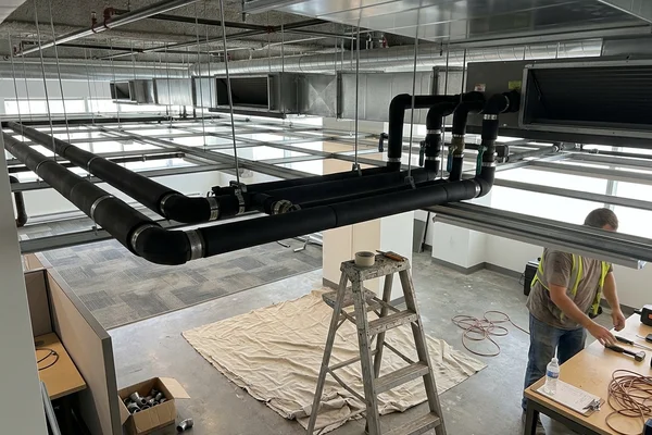 New chilled water branch piping on a renovated office floor