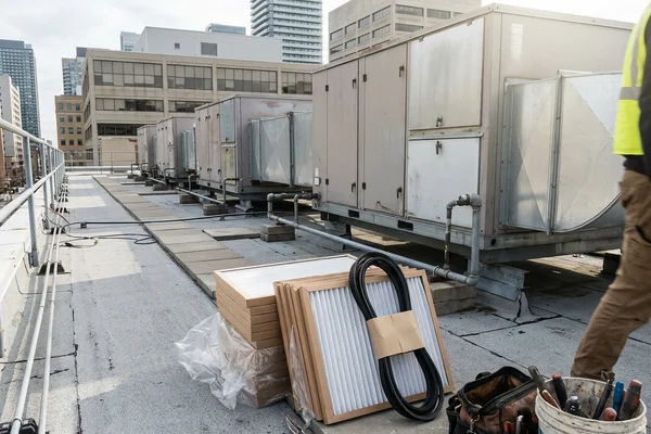 Filters and belts staged for a maintenance visit